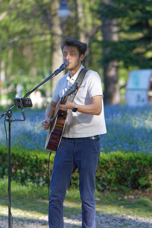 Boy playing guitar in the park